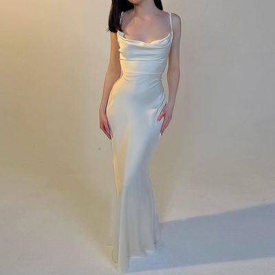 Viento de verano temperamento Europa y Estados Unidos nuevo color sólido empalme de encaje cintura larga delgada vestido de correa